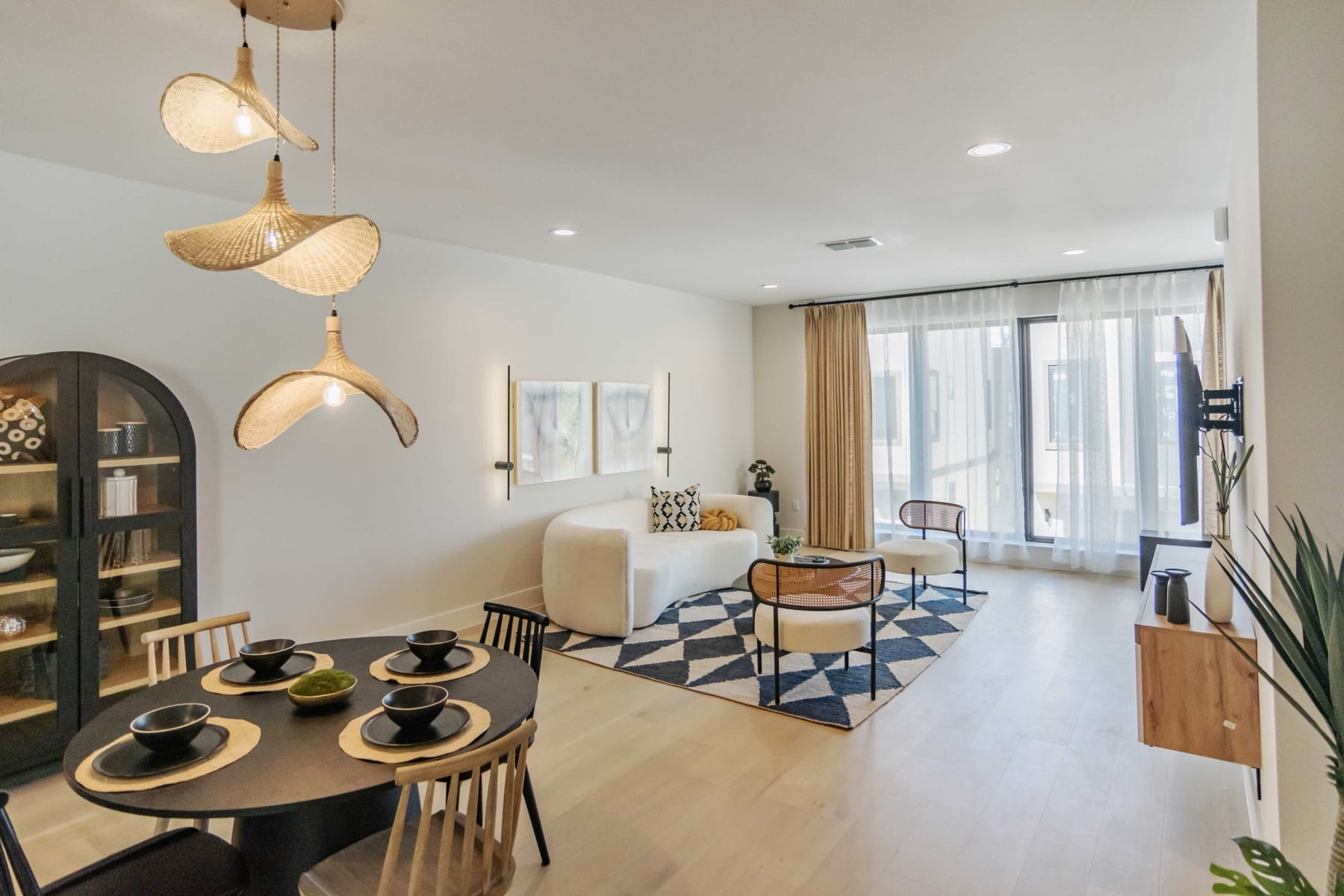 Staged living and dining room with professional lighting